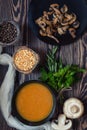 Pea soup and fried mushrooms in black plates Royalty Free Stock Photo