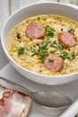 Pea soup with smoked sausage and rye bread with bacon. Royalty Free Stock Photo