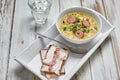 Pea soup with smoked sausage and rye bread with bacon. Royalty Free Stock Photo