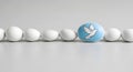 Peace Dove Egg Standing Out in a Row of White Eggs Royalty Free Stock Photo