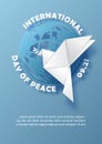 Peace dove in origami paper cut style on global with wording of the Peace day on blue paper pattern background
