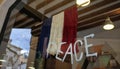 Peace and french flag on store showcase