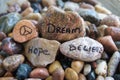 Peace, Hope, Dream and Believe Handwritten on River Rock Royalty Free Stock Photo