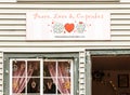 Peace, love and cupcakes sign above window