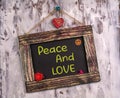 Peace and love written on Vintage sign board