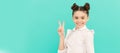 Peace maker. School age kid show V sign. Happy kid blue background. Child face, horizontal poster, teenager girl Royalty Free Stock Photo