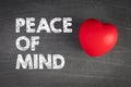 Peace of mind. Red rubber heart on a chalk board Royalty Free Stock Photo