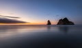 Peace of mind sunset in Wharariki beach in new zealand with water and clouds movement