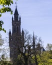 Peace Palace behind a woodland, Vredespaleis, under a pure gradient blue sky, seat of the ICJ, International Court of Justice, Royalty Free Stock Photo