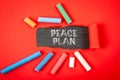 Peace Plan. Text under torn red paper on a blackboard Royalty Free Stock Photo