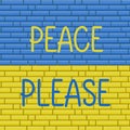 Peace please - lettering with Ukraine flag on the background of a brick wall. International protest, Stop the war Royalty Free Stock Photo