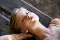 Peace and quiet in the park. a beautiful young woman lying down on a bench outside. Royalty Free Stock Photo