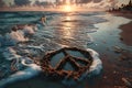 Peace sign drawn in sand on a beach with waves gently approaching Royalty Free Stock Photo