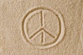 Peace Sign drawn in sand macro photo