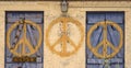 Peace sign repeated symbol on abandoned building