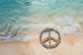 Peace symbol rocks on a beautiful tropical calm sandy beach shoreline. Royalty Free Stock Photo