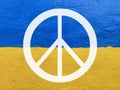 Peace symbol on Ukrainian flag painted on wall Royalty Free Stock Photo