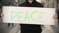 PEACE text on an activism banner