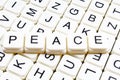 Peace text word crossword title caption label cover background. Alphabet letter toy blocks. White alphabetical letters. Royalty Free Stock Photo