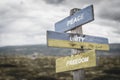 Peace unity freedom text quote on wooden signpost outdoors, written on the ukranian flags Royalty Free Stock Photo