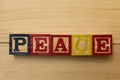 Peace wood cube words on wooden table cool