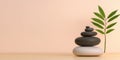 A peaceful arrangement of stacked stones and a green leaf on a serene background Royalty Free Stock Photo