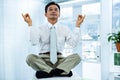 Peaceful asian businessman relaxing