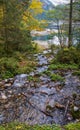 Peaceful autumn Alps mountain lake with clear transparent water and reflections. Gosauseen or Vorderer Gosausee lake, Upper Royalty Free Stock Photo