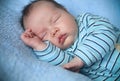 Peaceful baby lying on a bed while sleeping