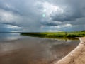 Peaceful beach dunegrass and storm clouds