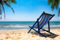 A peaceful beach scene in Thailand, exotic tropical beach landscapes and blue sea under a blue background. Relaxing summer holiday Royalty Free Stock Photo