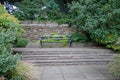 Peaceful bench in a garden Royalty Free Stock Photo