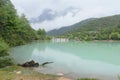 peaceful blue lake with mountain background after rain