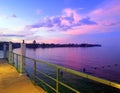 A colorful sky and a calm sea.