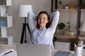 Peaceful calm woman relaxing at workplace after work done Royalty Free Stock Photo