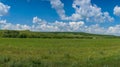 Peaceful countryside landscape with green grass meadow