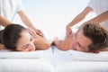 Peaceful couple enjoying couples massage poolside Royalty Free Stock Photo