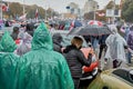 October 11 2020 Minsk Belarus Peaceful demonstration as participants in raincoats walk down the street in the rain Royalty Free Stock Photo