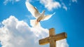 Peaceful dove flying over a wooden cross against blue sky.