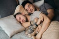 A homosexual couple on bed in studio with loft interior Royalty Free Stock Photo