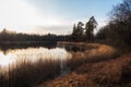 Peaceful evening landscape with a lake in early spring Royalty Free Stock Photo