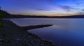 Peaceful evening landscape wilderness river shore line without people here twilight lighting darkness time after sunset Royalty Free Stock Photo