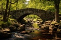 A peaceful forest scene with a stone bridge over a gently flowing stream and a wooden pathway, An old stone bridge over a quiet Royalty Free Stock Photo