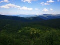 Peaceful green mountains covered of grass under the clear blue sky Royalty Free Stock Photo