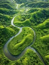 The peaceful green river winds elegantly through undulating hills, creating a harmonious natural pattern as viewed from Royalty Free Stock Photo