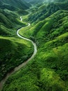 The peaceful green river winds elegantly through undulating hills, creating a harmonious natural pattern as viewed from Royalty Free Stock Photo