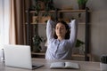 Peaceful happy young beautiful business woman resting at workplace. Royalty Free Stock Photo