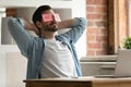 Peaceful young man relaxing with sticky paper notes on eyes. Royalty Free Stock Photo