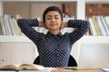 Peaceful indian girl relax at workplace with eyes closed Royalty Free Stock Photo