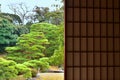Peaceful Japanese garden from paper window, Japan Royalty Free Stock Photo